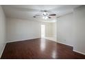 Bright living room with hardwood floors, ceiling fan, and neutral wall colors at 5112 Londonderry Blvd, Orlando, FL 32808