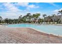 Resort-style pool with lounge chairs and brick patio at 523 Lazio Cir, Debary, FL 32713
