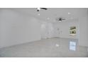 Bright and airy living room with tile floors and lots of natural light at 13497 Se 100Th Ave, Belleview, FL 34420