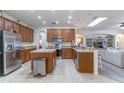 Island kitchen with stainless steel appliances and ample counter space at 2048 Gloria Oak Ct, Orlando, FL 32820