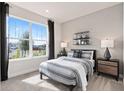Guest bedroom with a full bed, large window, and nice view at 2066 Branched Oak Rd, St Cloud, FL 34771