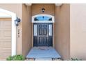 Dark-colored front door with a glass window accent at 245 Viola Dr, Auburndale, FL 33823