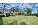 Large backyard with playset and volleyball net, perfect for  at 291 Lasso Dr, Kissimmee, FL 34747
