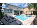 Inviting backyard oasis with a refreshing pool and spa at 291 Lasso Dr, Kissimmee, FL 34747