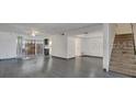 Bright and airy living room with hardwood floors and staircase at 5419 Fairwood Way # 305, Orlando, FL 32808