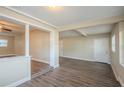 Spacious living room with wood-look floors and a neutral color scheme at 5624 Balboa Dr, Orlando, FL 32808
