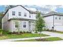 Attractive two-story home with well-kept lawn and convenient two-car garage at 5680 Brosnan Rd, St Cloud, FL 34771