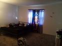 Bedroom with a double bed and patterned curtains at 7628 Forest City Rd # 056 Aka H, Orlando, FL 32810