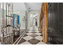 Elegant entryway with checkered floor and unique decor at 817 Antonette Ave, Winter Park, FL 32789