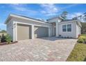 Two-car garage and paver driveway at 1062 Liliana Dr, Deland, FL 32724