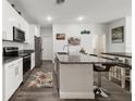 Modern kitchen with a large island and plenty of cabinet space at 1630 W New York Ave, Orange City, FL 32763