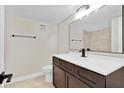 Modern bathroom with dark vanity, updated fixtures and tile at 1964 Lake Atriums Cir # 175, Orlando, FL 32839