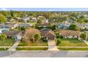 Aerial view of a residential neighborhood, showcasing houses and surrounding landscape at 2712 Ceram Ave, Orlando, FL 32837