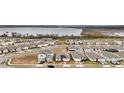 Aerial view of a residential neighborhood near a lake at 3037 Cassidy Ln, Haines City, FL 33844
