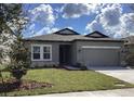 Beautiful single-story home with well-maintained lawn and stone accents at 329 Conway Ave, St Cloud, FL 34771