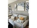 Living room with couch and decorative pillows at 335 N Causeway # C23, New Smyrna Beach, FL 32169