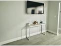 Living room with a console table and mounted TV at 4803 Roush Ave, Orlando, FL 32803