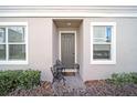 Inviting front entrance with small patio seating area at 1008 E 10Th St, Apopka, FL 32703