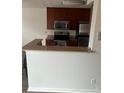 Modern kitchen with granite countertops and stainless steel appliances at 11568 Westwood Blvd # 1034, Orlando, FL 32821