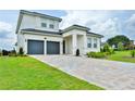 Two-story house with a two-car garage and nicely landscaped yard at 16000 Volterra Pt, Montverde, FL 34756