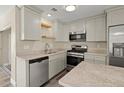 Modern kitchen with stainless steel appliances and light cabinets at 1609 Stocking St, Daytona Beach, FL 32117