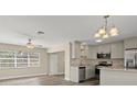 Renovated kitchen featuring modern appliances and granite countertops at 1609 Stocking St, Daytona Beach, FL 32117