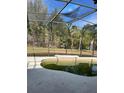 Kidney-shaped pool with screen enclosure needs cleaning at 5427 Los Palma Vista Dr, Orlando, FL 32837