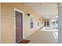 Hallway with access to multiple rooms and an exterior door at 114 Rum Run, Davenport, FL 33837