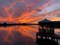 Stunning sunset over lake with gazebo at 15040 Ne 248Th Avenue Rd, Fort Mc Coy, FL 32134