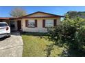 Charming one-story home with mature landscaping, natural light and neutral color palette at 2101 La Due Ct, Orlando, FL 32811