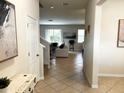 Bright entryway with tile flooring, leading to living room at 2292 Grantham Ave, Davenport, FL 33837