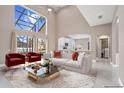 Open-concept living room with comfortable seating and view to the kitchen at 231 Chestnut Ridge St, Winter Springs, FL 32708