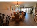 Dining room with partial living room view at 3501 S Atlantic Ave # 6060, New Smyrna Beach, FL 32169