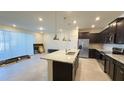 Modern kitchen with granite countertops and stainless steel appliances at 4114 Lana Ave, Davenport, FL 33897