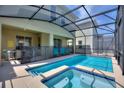 Relaxing pool and spa with covered patio and comfortable seating at 4285 Prologue Way, Kissimmee, FL 34746