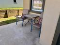 Cozy patio with seating, perfect for relaxing and enjoying the outdoors at 525 Aster Dr, Davenport, FL 33897