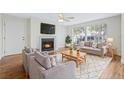 Inviting living room with fireplace, hardwood floors, and a comfortable seating area bathed in natural light at 686 Roaring Dr # 343, Altamonte Springs, FL 32714