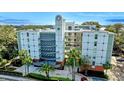 Modern condo building in a lakeside community with lush landscape and secure access at 690 Osceola Ave # 604, Winter Park, FL 32789