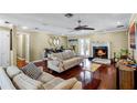 Living room featuring hardwood floors, fireplace, and a comfortable seating area at 718 32Nd St, Orlando, FL 32806
