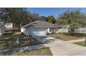 An elevated shot of a well-maintained home featuring a long driveway at 1001 Willow Run St., Minneola, FL 34715