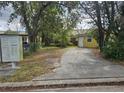 Yellow house with driveway and mailboxes at 1040 Maxey Dr, Winter Garden, FL 34787
