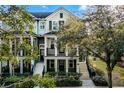 Two-story townhome with balcony and lush landscaping at 1197 Orange Ave, Winter Springs, FL 32708