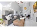 Spacious living room with L-shaped sectional sofa and fireplace at 136 Madiera Beach Blvd, Kissimmee, FL 34746