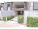Inviting building exterior featuring covered parking, lush greenery, and well-maintained landscaping at 1928 Conway Rd # 27, Orlando, FL 32812