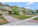 Townhome community with multiple units and parking at 2311 Chatham Place Dr, Orlando, FL 32824
