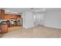 Modern kitchen with stainless steel appliances and wood cabinets at 2311 Chatham Place Dr, Orlando, FL 32824
