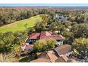 Aerial view of estate home showcasing backyard pool and golf course views at 236 Acadia Ter, Celebration, FL 34747