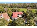 Luxury home with red tile roof, situated on a golf course community at 236 Acadia Ter, Celebration, FL 34747