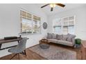 Home office featuring a desk, couch, and large windows at 2513 Castle Pines St, Clermont, FL 34711