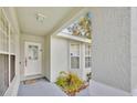 Front entry with white door and neutral-toned walls at 2627 Oneida Loop, Kissimmee, FL 34747